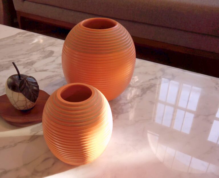 Pair of Terracota flower pots on a marble top centre table